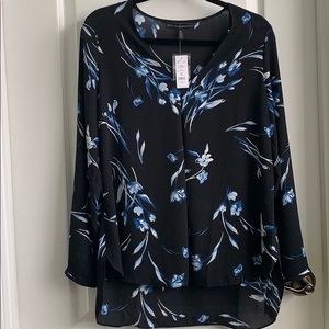 Black V neck pleated blouse.